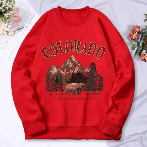 Woman wearing vintage travel print oversized hoodie