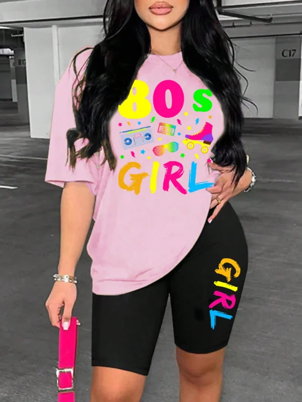 Woman wearing colorful 80s print t-shirt and matching casual shorts two-piece set.