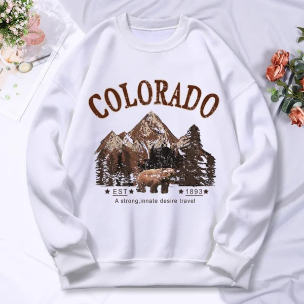 Woman wearing vintage travel print oversized hoodie