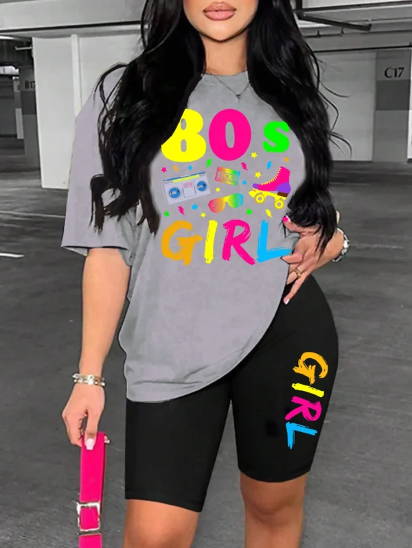 Woman wearing colorful 80s print t-shirt and matching casual shorts two-piece set.