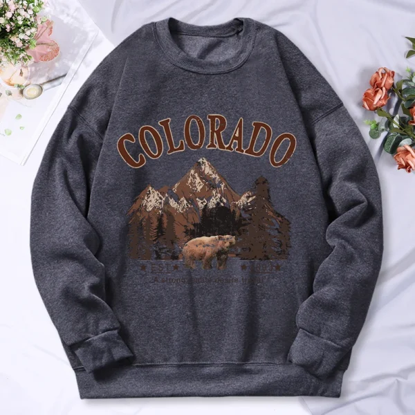 Woman wearing vintage travel print oversized hoodie