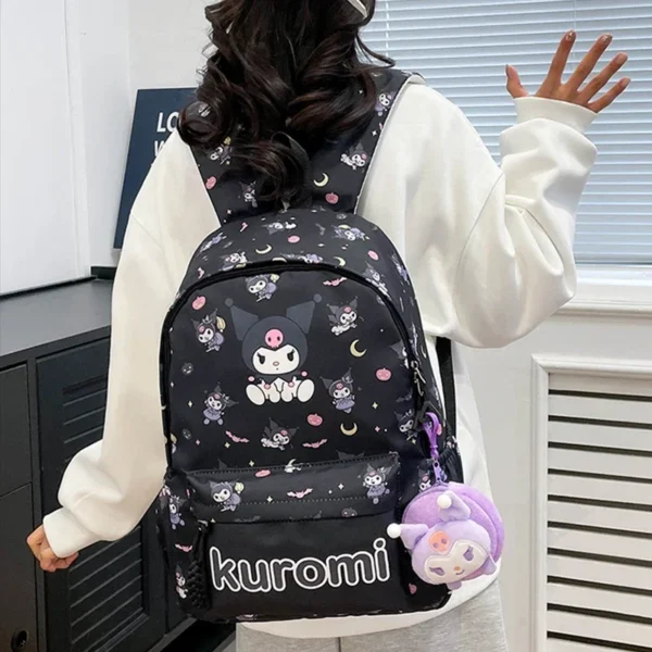 MINISO Sanrio Characters kawaii nylon backpack for girls with matching wallet charm.