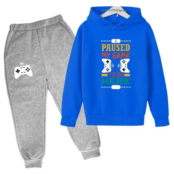 Kids gamer tracksuit set with 'I Paused My Game To Be Here' slogan on hooded sweatshirt and matching pants for boys or girls.