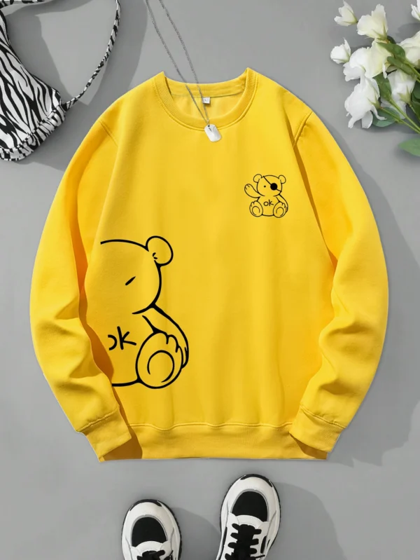 Women's retro beige fleece hoodie with a cute Kawaii teddy bear 'OK' print graphic on the front.