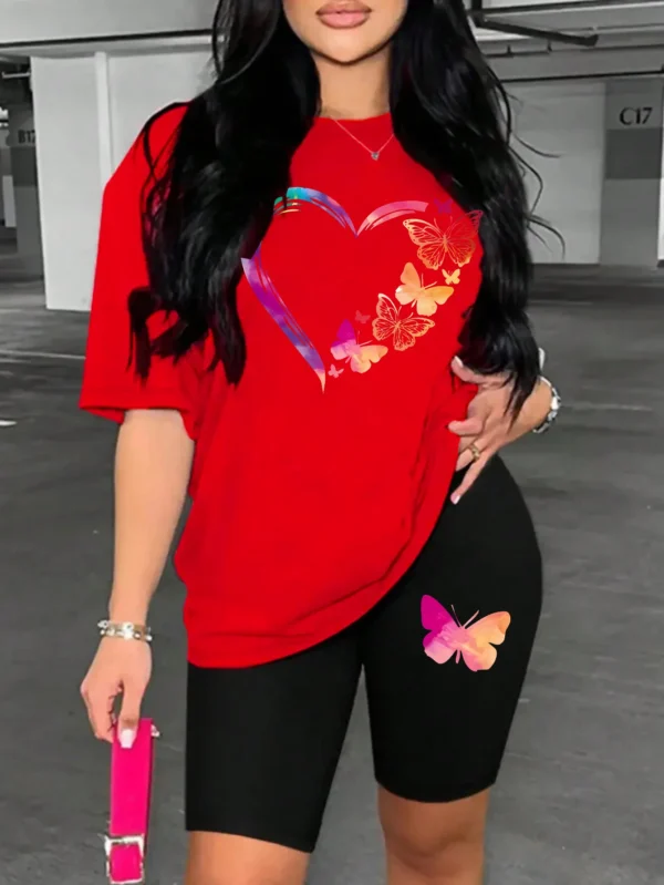 Woman modelling a comfortable butterfly print t-shirt and matching shorts set - summer casual wear.