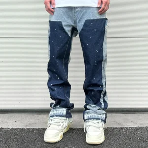 Men's speckled ink Y2K baggy patchwork jeans with fringe.