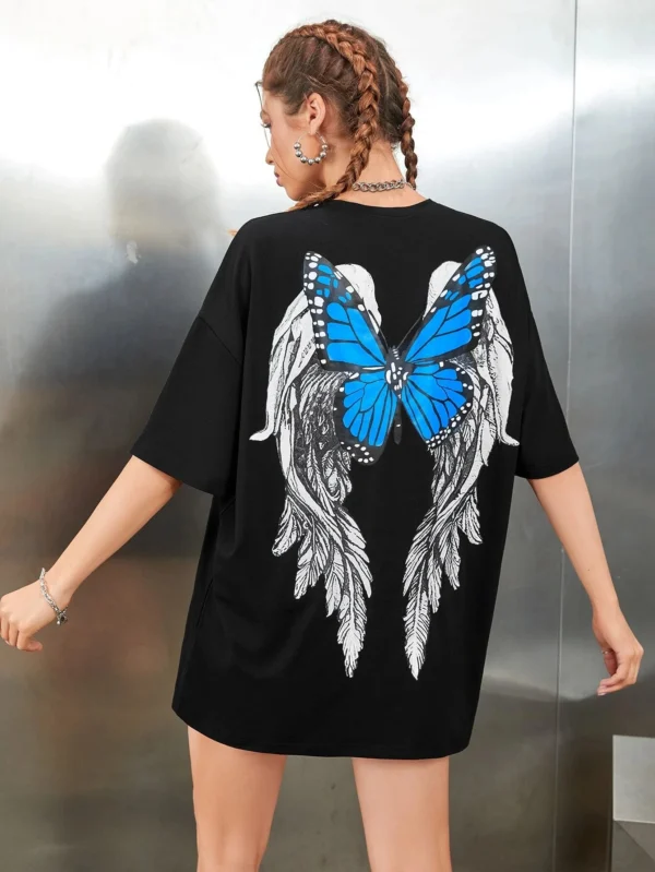 Woman wearing a white butterfly print t-shirt.