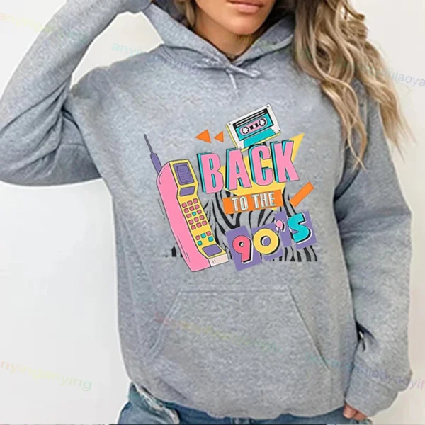Woman wearing a vibrant neon hoodie with 'Take Me Back To The 90's' graphic print