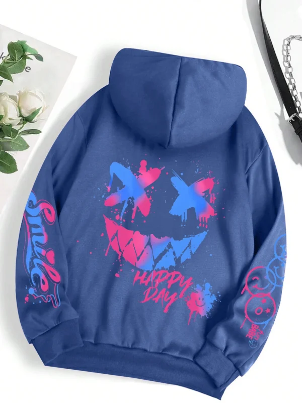 Front view of a woman wearing the oversized graffiti print hoodie
