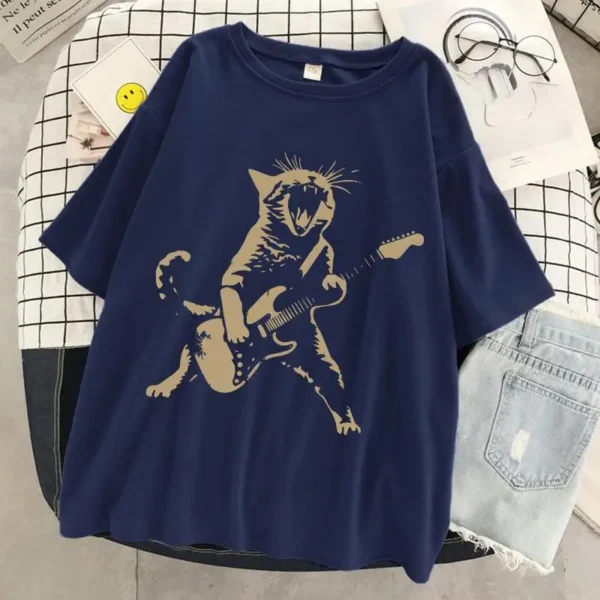 Woman wearing a funny cat playing guitar t-shirt.