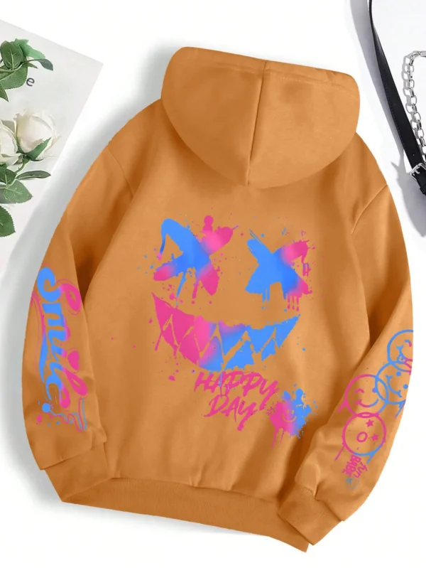 Front view of a woman wearing the oversized graffiti print hoodie