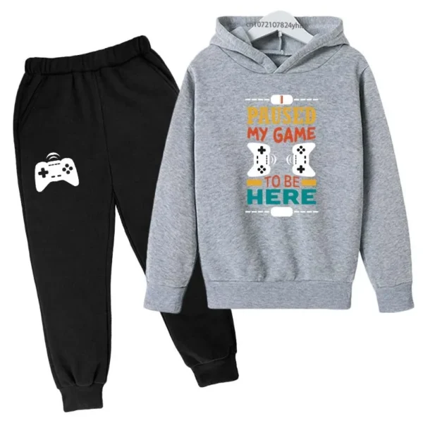 Kids gamer tracksuit set with 'I Paused My Game To Be Here' slogan on hooded sweatshirt and matching pants for boys or girls.