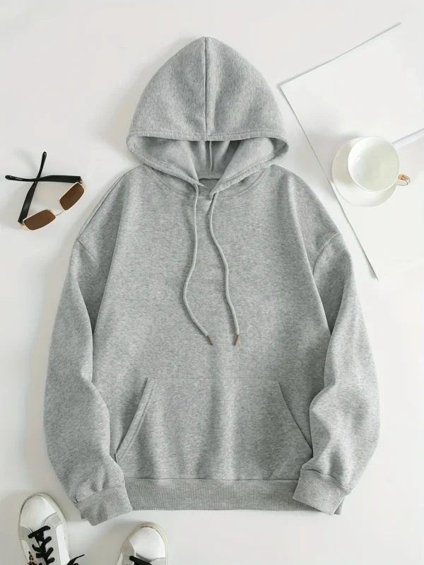 Woman wearing a "My Shadow Has Four Legs" fleece hoodie.