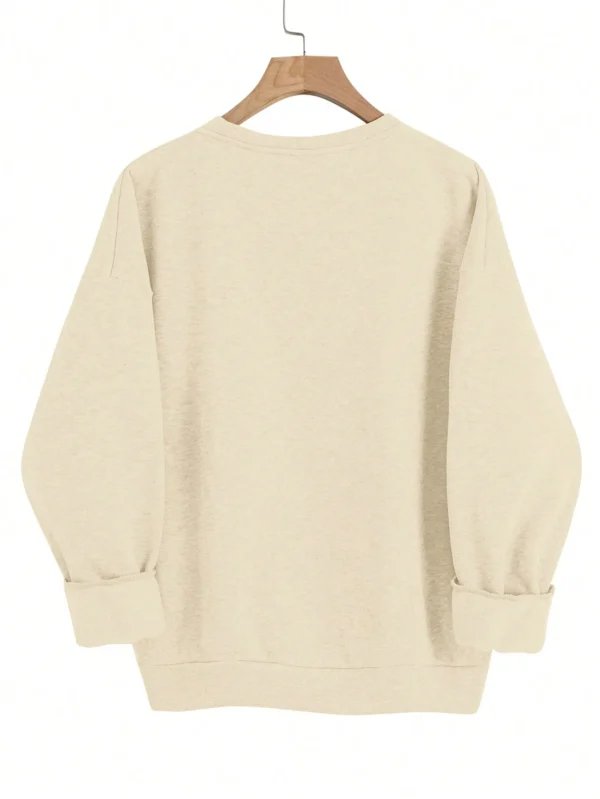 Woman wearing a "Nope Not Today" retro print sweatshirt.