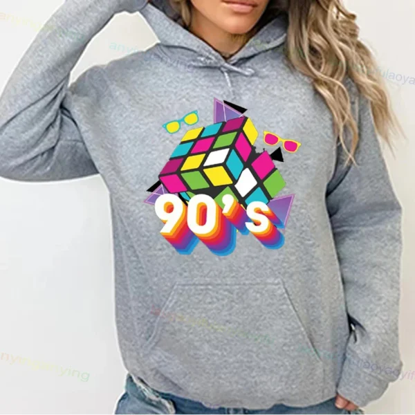 Woman wearing a vibrant neon hoodie with 'Take Me Back To The 90's' graphic print