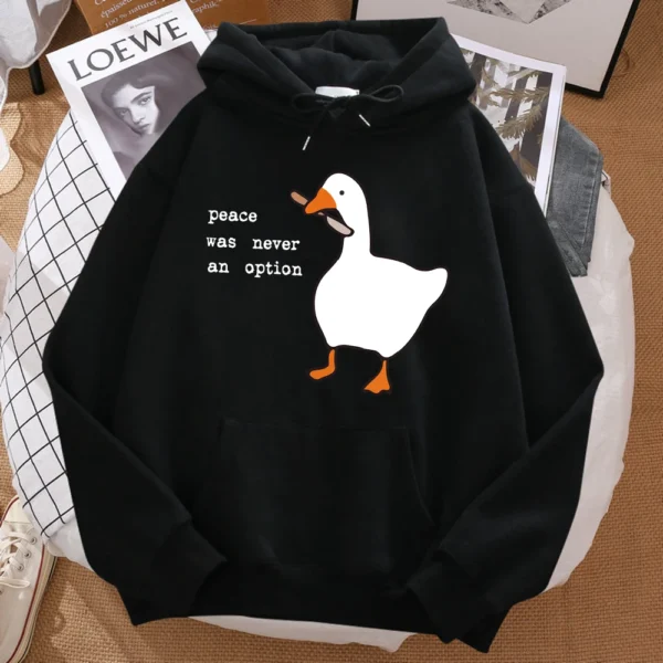 Man wearing black oversized hoodie with white 'Peace Was Never An Option' graphic text print centred on the chest.