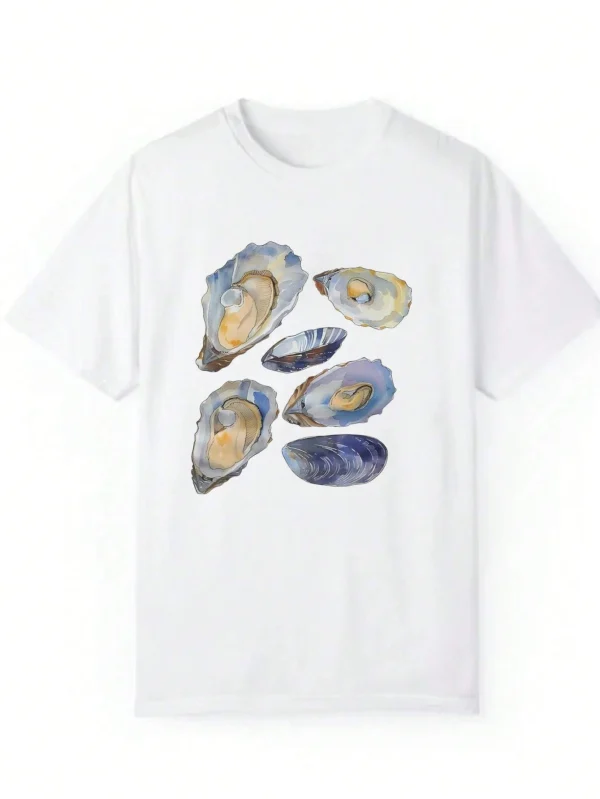 Woman wearing a casual white t-shirt with a blue and beige vintage seashell print.