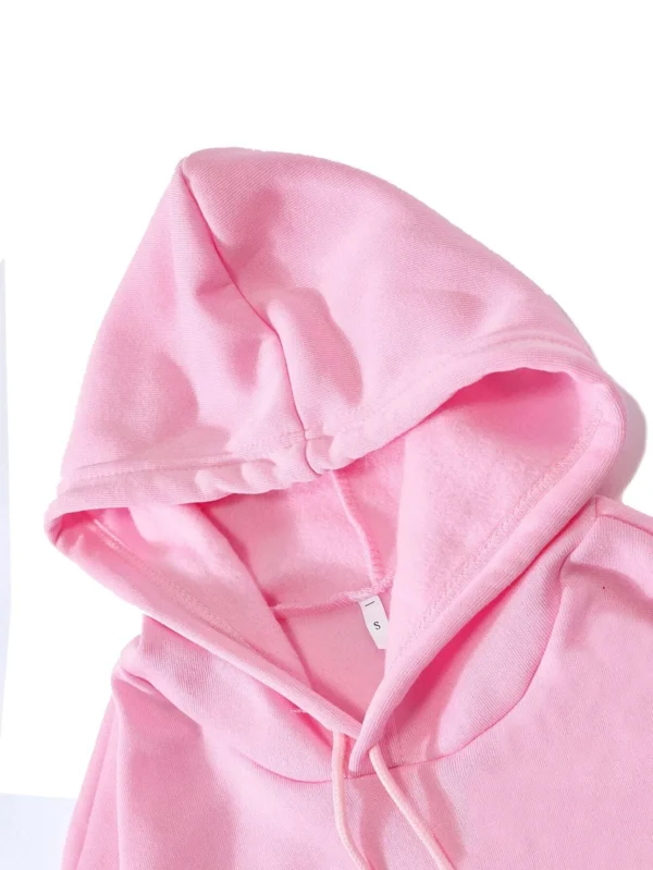 Woman wearing the warm grey fleece pullover hoodie with the funny 'Expensive Talks Back' print on the front.