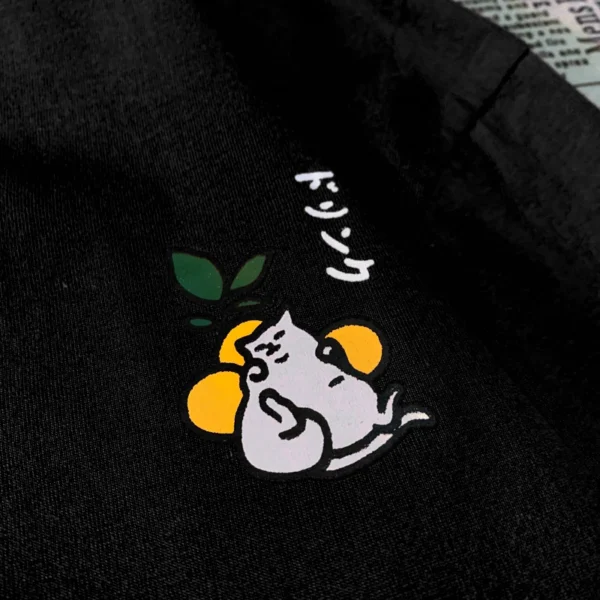 Oversized cotton t-shirt with a Japanese cat print graphic on the front