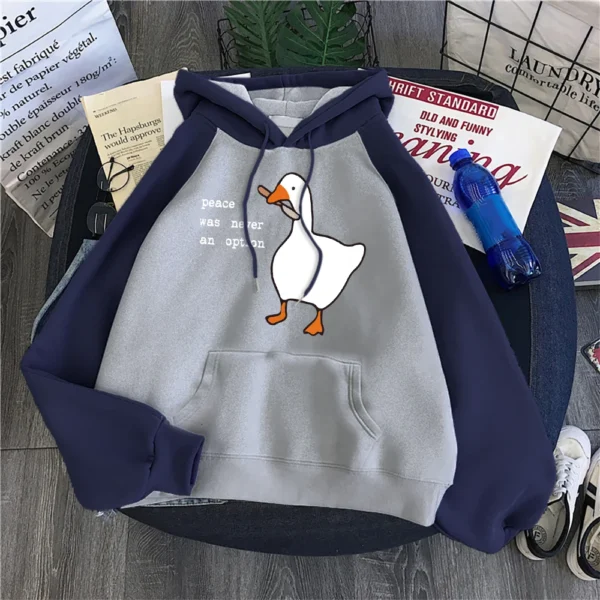 Woman wearing a black "Peace Was Never An Option" printed hoodie.