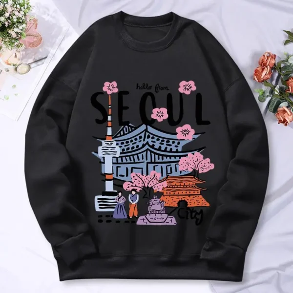 Woman wearing a warm casual hoodie with a colorful Seoul cityscape scenery print.