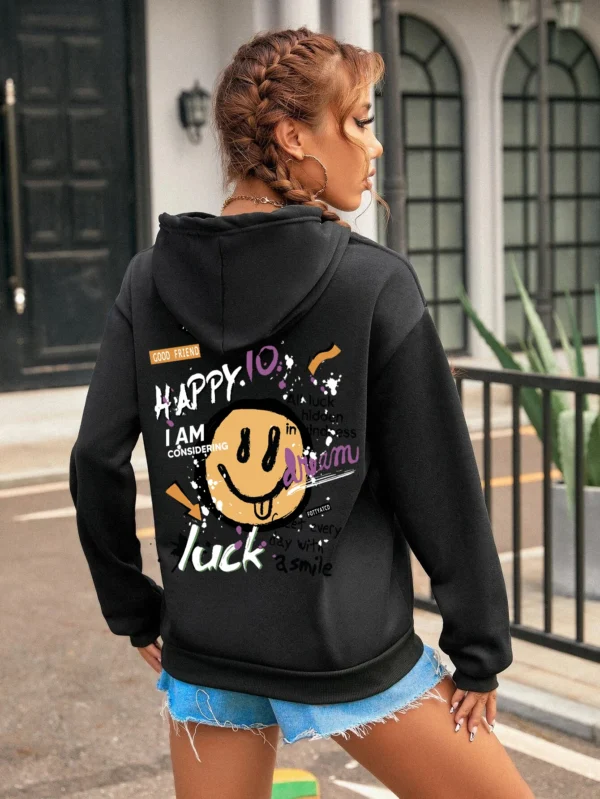 Woman wearing a casual fleece-lined hoodie with a colourful all-over graffiti street art print.