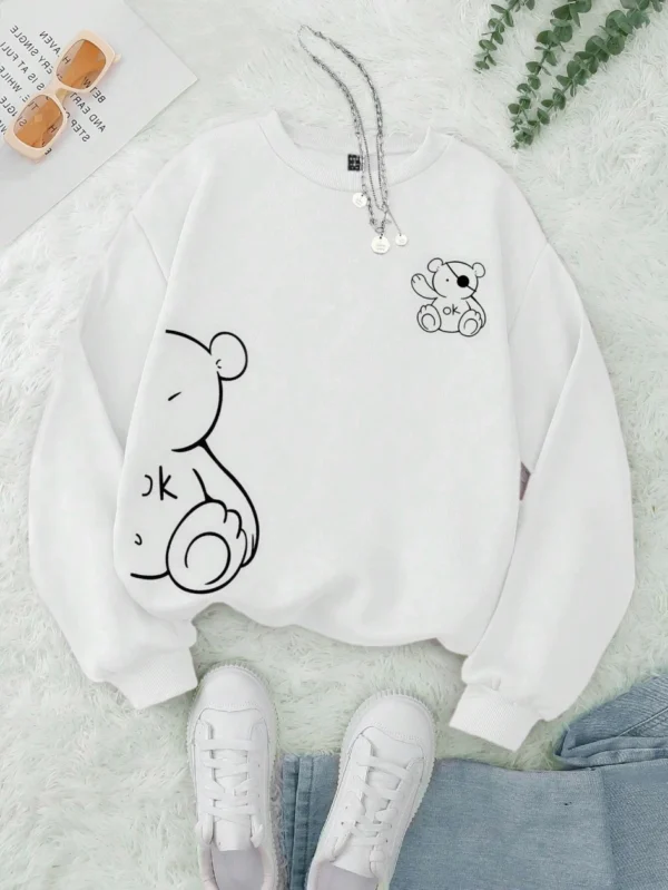 Women's retro beige fleece hoodie with a cute Kawaii teddy bear 'OK' print graphic on the front.