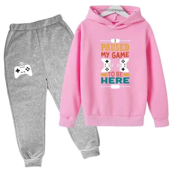 Kids gamer tracksuit set with 'I Paused My Game To Be Here' slogan on hooded sweatshirt and matching pants for boys or girls.