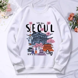 Woman wearing a warm casual hoodie with a colorful Seoul cityscape scenery print.