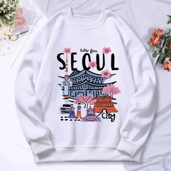 Woman wearing a warm casual hoodie with a colorful Seoul cityscape scenery print.