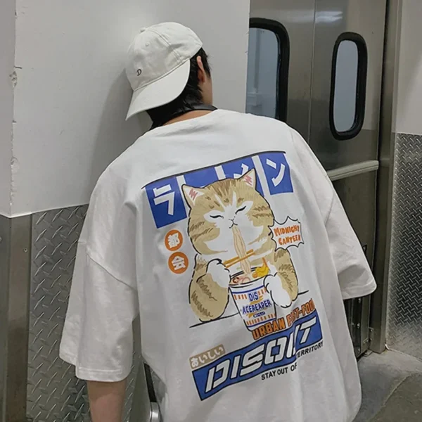 White oversized t-shirt with a cartoon graphic of a cute cat happily eating noodles from a bowl