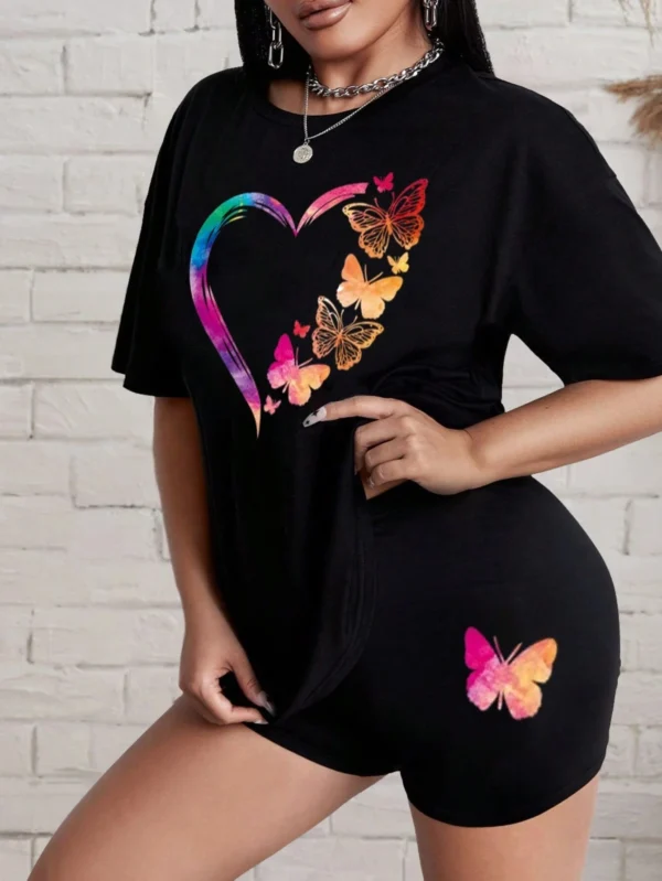 Woman modelling a comfortable butterfly print t-shirt and matching shorts set - summer casual wear.