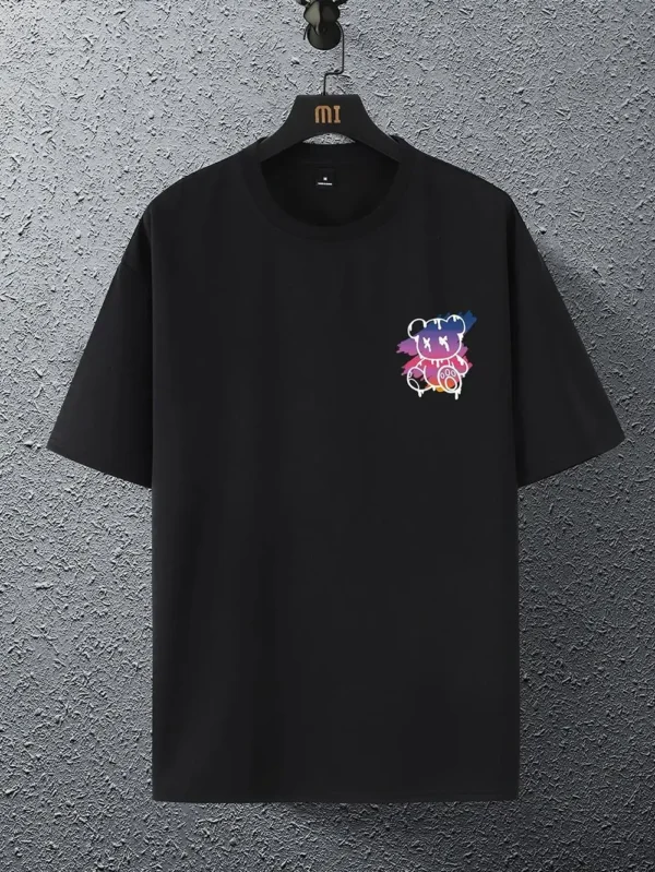 Men's loose fit cotton t-shirt displaying a colorful graphic print of a cartoon bear in front of a New York sunset scene.