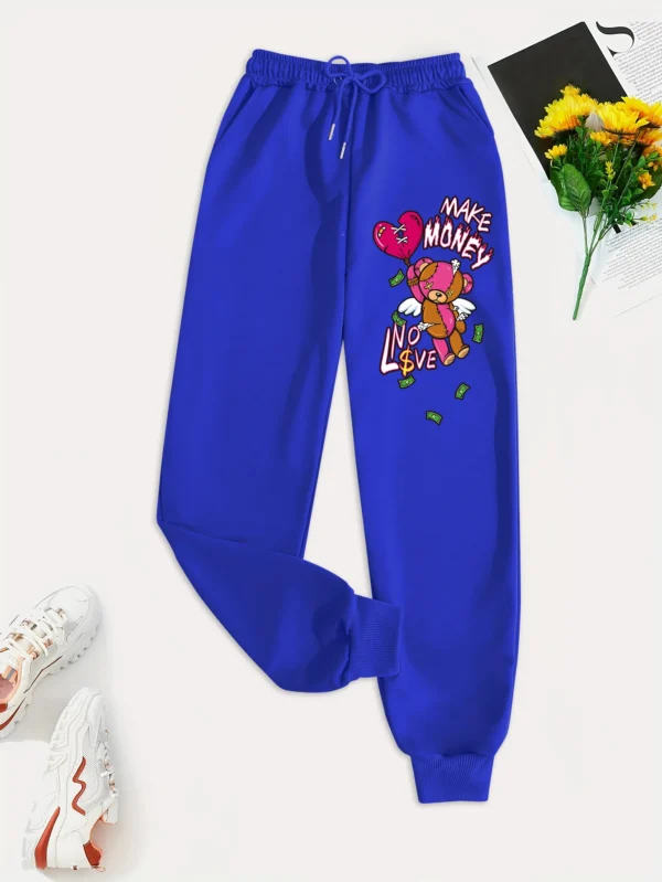 Women's knit streetwear pants featuring a large cartoon bear graphic print on the leg - casual hip hop style.