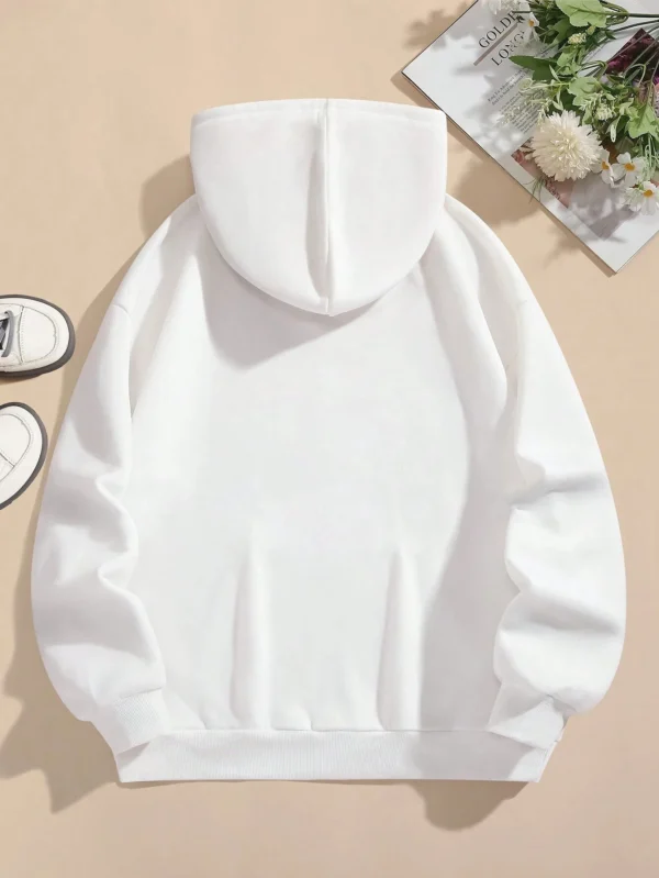Woman wearing the warm fleece-lined 'I'm Just A Girl' pullover hoodie against a neutral background.