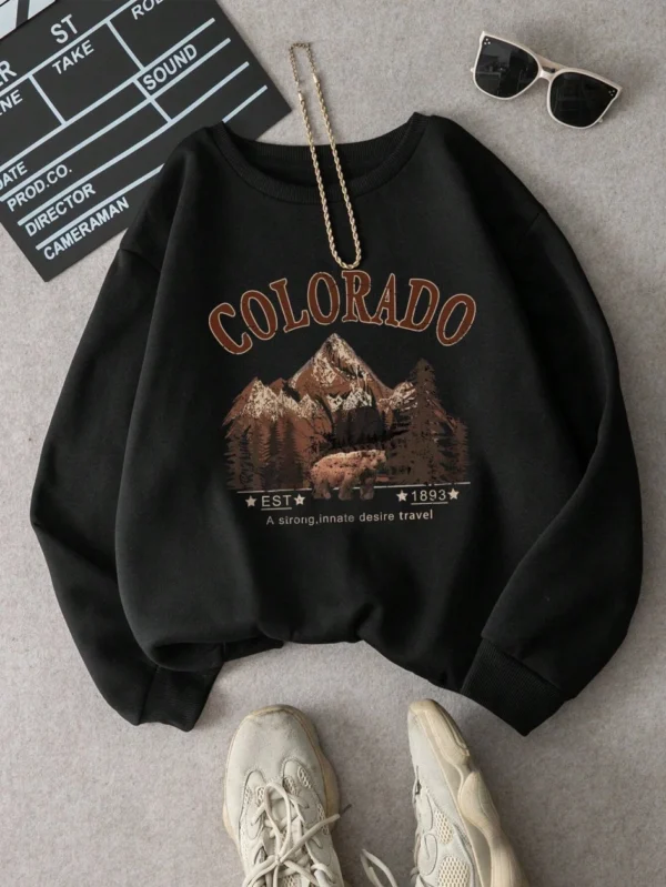 Woman wearing vintage travel print oversized hoodie
