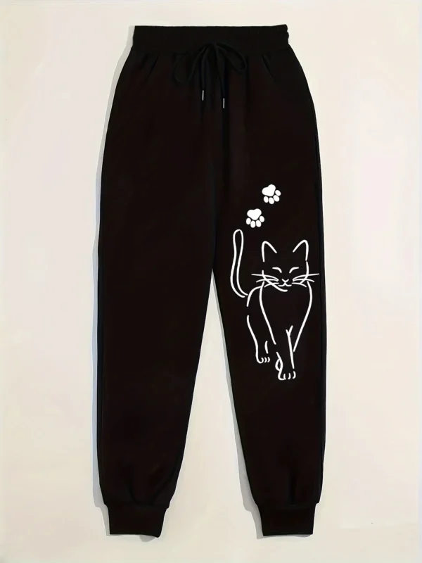 Woman wearing grey casual sweatpants with black cat print