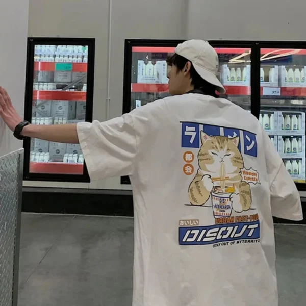 White oversized t-shirt with a cartoon graphic of a cute cat happily eating noodles from a bowl