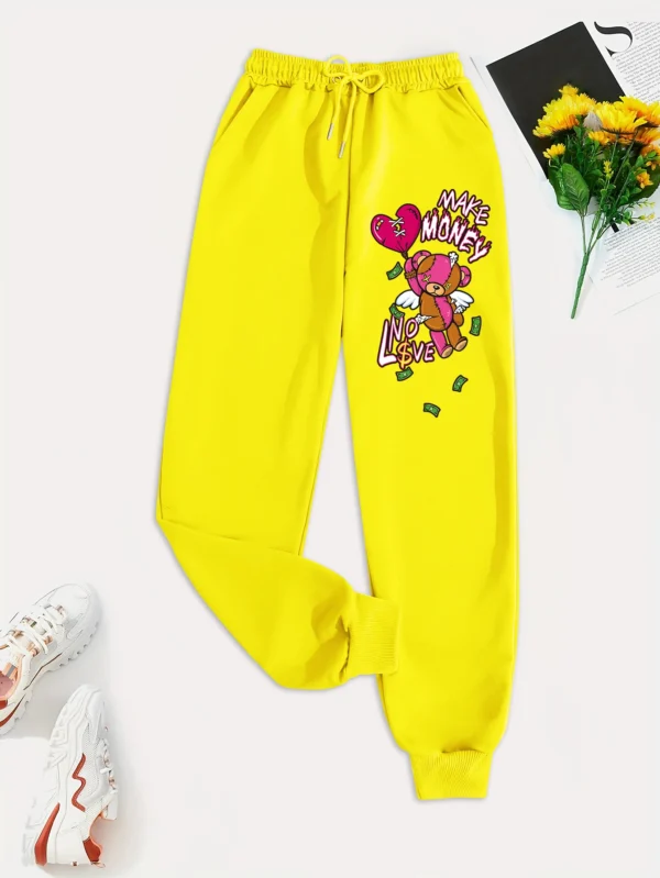 Women's knit streetwear pants featuring a large cartoon bear graphic print on the leg - casual hip hop style.