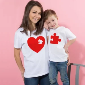 Mom and child wearing cute matching white 'I Love Mom' family t-shirts