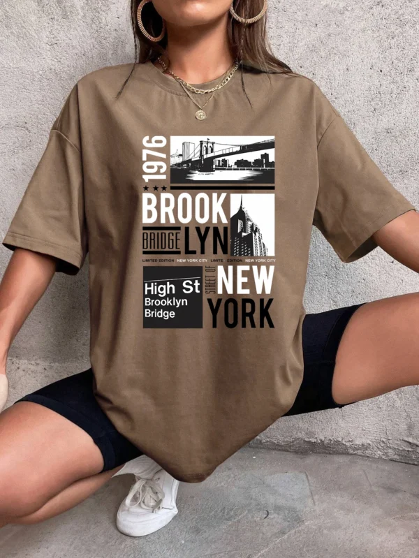 Woman wearing casual white t-shirt with retro "Brooklyn 1976 New York" graphic print.
