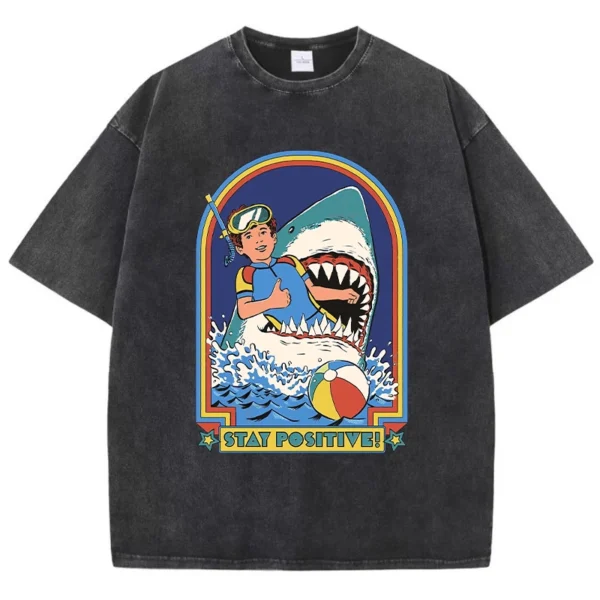 Woman wearing white O-neck t-shirt with colourful "Stay Positive" cartoon graphic print on the front.