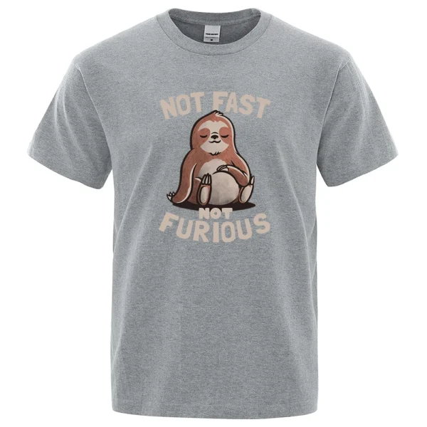 Oversized white cotton t-shirt for men featuring a funny kawaii sloth print and the text "Not Fast Not Furious". ```