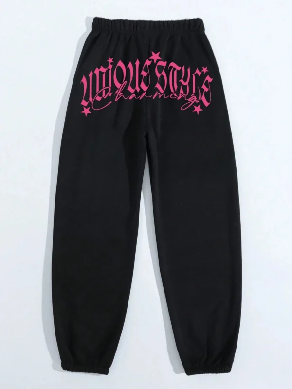Women's pink loose casual hip hop pants with white letter print graphic - streetwear style trousers for autumn/winter.