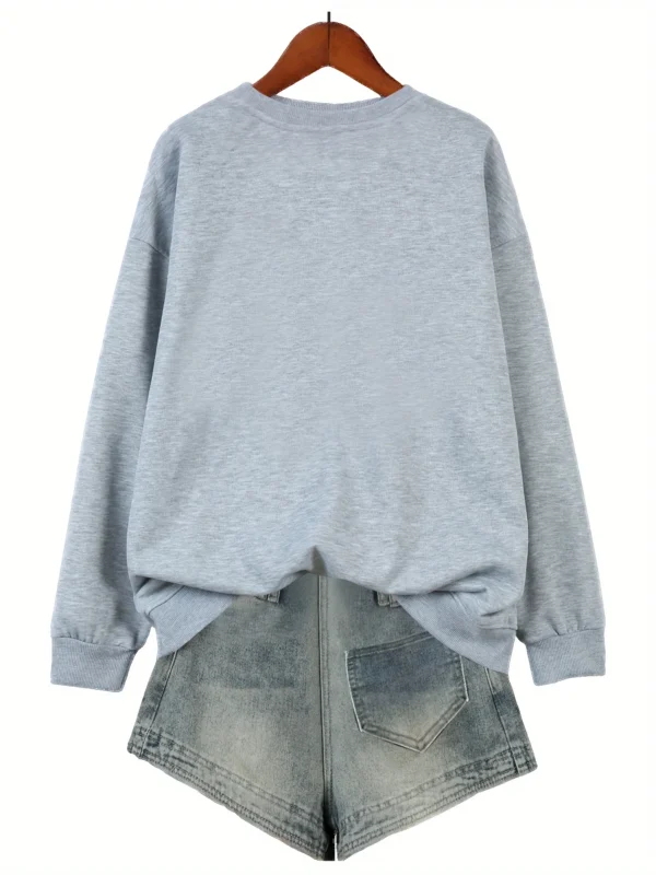 Woman wearing a "Nope Not Today" retro print sweatshirt.