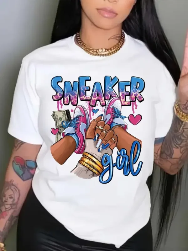 Women's short sleeve crew neck t-shirt with a colourful Kawaii style graphic print featuring a girl and sneakers motif. ```
