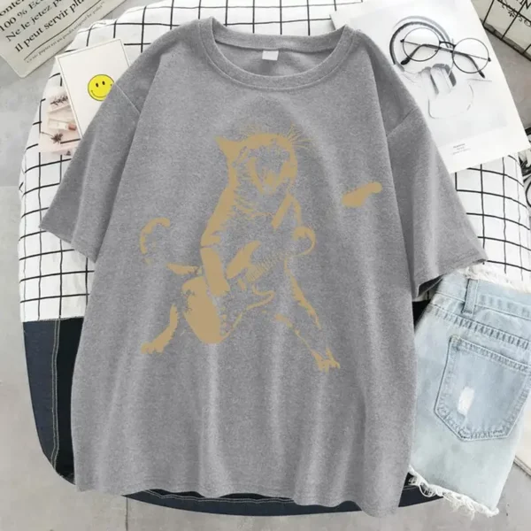 Woman wearing a funny cat playing guitar t-shirt.