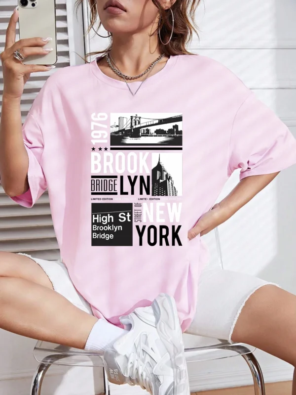 Woman wearing casual white t-shirt with retro "Brooklyn 1976 New York" graphic print.
