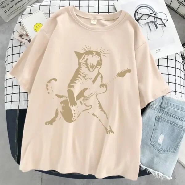 Woman wearing a funny cat playing guitar t-shirt.