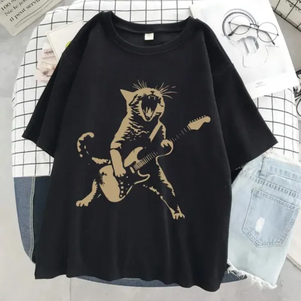 Woman wearing a funny cat playing guitar t-shirt.